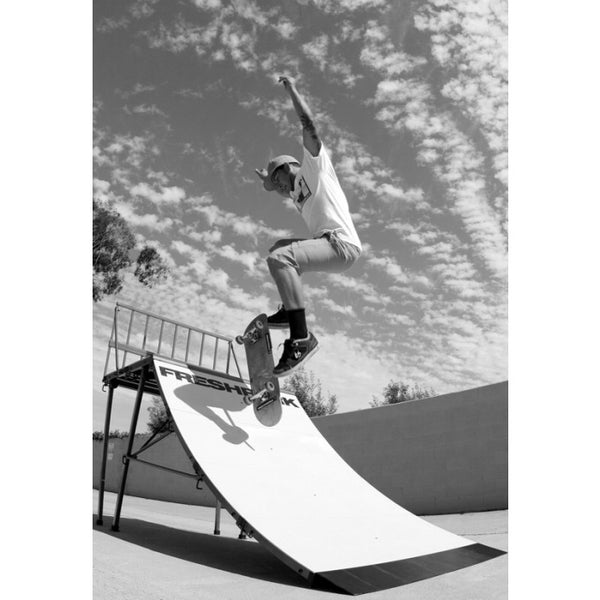 Skateboard on Freshpark 4 by 4 Quarter Pipe Jump
