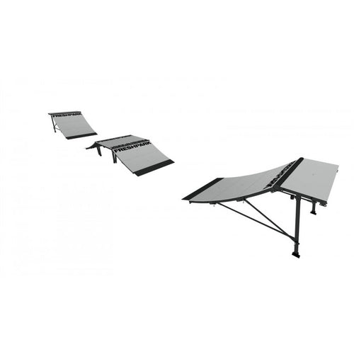 A set of skate park ramps and elements, including quarter pipes and launch ramps, designed to be portable and set up outdoors.