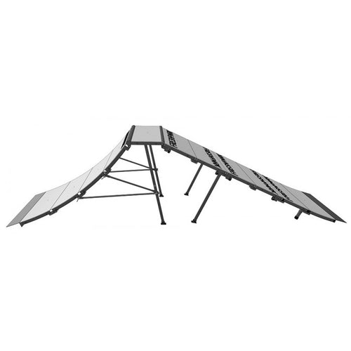 A metal skate ramp setup consisting of multiple components including a quarter pipe, extension kit, fun boxes, and a launch ramp, all arranged for skateboarding activities.